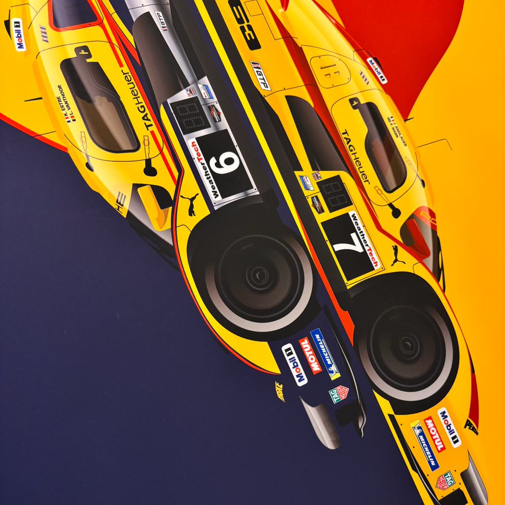 A close-up graphic of two yellow race cars with black and red livery, shown diagonally on a dark navy and yellow background. Visible branding includes Puma, Castor, and other sponsor logos.